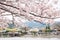 Arashiyama river and old village with cherry blossoms at spring in Kyoto, Japan