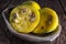 Araza fruits in a wooden bowl on rustic background