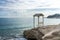 Arbor on the rock near the beach with beautiful waves. Cyprus, February 2019.