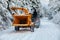Arborist pulls wood chipper in winter