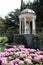 Arbour with waterfall in garden