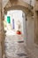 The Arc and alley of Ostuni with white houses Italy