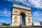 Arc de Triomphe on blue sky background in Paris.