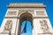 Arc de Triomphe on blue sky in Paris