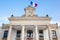 Arcachon city French tricolor flag with mairie liberte egalite fraternite france text building mean town hall and freedom equality