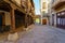 Arcades of medieval buildings in the alley of access to the main square of the town, San Esteban de Gormaz.