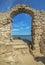 The arch of the ancient fortress of Cape Kaliakra above the sea against the background of the azure sky. Northern Black Sea Coast,