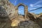 The arch of the ancient fortress of Cape Kaliakra above the sea against the background of the azure sky. Northern Black Sea Coast,