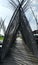 The arch of the bamboo walkway leads to the rice fields.