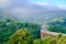 Arch bridge across the gorge in the Apennine mountains before the oncoming thunderstorm