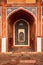 Arch with carved marble window. Humayun\'s tomb, Delhi