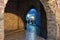 Arch entrance with stone walls to the old city of  Ioannina at night, Greece