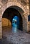 Arch entrance with stone walls to the old city of  Ioannina at night, Greece