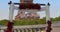 Arch with flowers in front of the Eiffel Tower in Paris. Establishing shot man making surprise proposal of marriage to