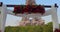 Arch with flowers in front of the Eiffel Tower in Paris. Establishing shot man making surprise proposal of marriage to