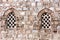 Arch and Intricate Details of Historic Mosque Windows: Exquisite Islamic Architecture in Close-Up
