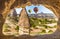 Arch in limestone in Goreme National Park, Cappadocia and hot air balloons