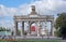 Arch of a main entrance at the All-Russia Exhibition Centre ENEA with a sculpture of the tractor operator and collective farmer.