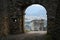 The arch of the old defensive fortress overlooking the modern city