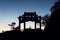 Arch and pavilion in silhouette on the summit of Taishan, China