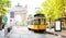 Arch of Peace view with nostalgic yellow tram in Milano, Italy
