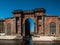 Arch of red brick on the island of New Holland with columns and