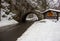 Arch and road in mountains in winter forest, Miskolc, Hungary. Miskolc road sign and medieval arch in mountain. Road in winter.