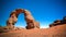 Arch Rock formation aka Arch of Africa or Arch of Algeria with moon at Tamezguida Tassili nAjjer national park Algeria