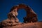 Arch Rock formation aka Arch of Africa or Arch of Algeria with moon in Tassili nAjjer national park in Algeria