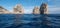 Arch in sea stacks off coast of Capri, Italy. They are named Stella, Faraglione di Mezzo with the arch, and Fraglione di Furori.