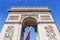 Arch of triumph with french flag in Paris, France