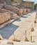 Archaeological remains with decorative tile floors and frescoes paintings in a hillside house on the slopes of the ancient city