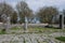 Archaeological site of Altilia, Molise, Italy: Remains of ancient columns and in the background the classic wall in reticulated wo