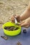 Archaeologist cleans and sorts finds made in a field expedition