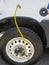 archaic yellow air tube system on the exterior of a vehicle to control tire pressure in off-road vehicles