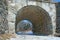 Arched bridge tunnel made of stone