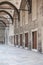 Arched ceiling Portico with doors in a row in the courtyard of a