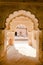 Arched corridor of the historic Orchha Fort in India, with its intricate architecture