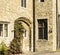 Arched door and leaded windows set in stone.