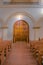 Arched double door with arched pillars below railings in a church at downtown Tucson, Arizona