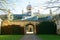 Arched entrance, domed clock tower, and dormer windows