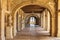 An arched exterior passageway at Hautefort Castle, Chateau de Hautfort