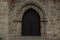 Arched Gate with Wooden Doors Wall of Stone Medieval Church