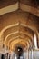 Arched hallway in the Hampi temple complex. Cultural heritage, ancient architecture of India