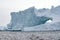 Arched iceberg in the frigid waters of Antarctica