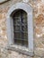 An arched medieval window with stone trim