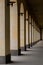 An arched passage near the building. Light passes through the arches.