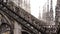 Arched passages and towers on the roof of the Duomo. Milan, Italy