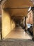 Arched passageway arcade in Bologna, Italy. Medieval street portico. Traveling.