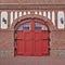 Arched red door, central Europe